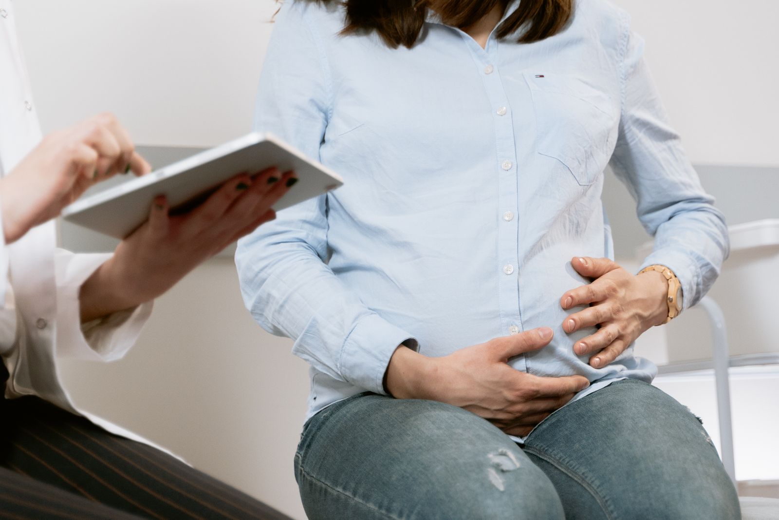 Care team reviewing prenatal information on a tablet