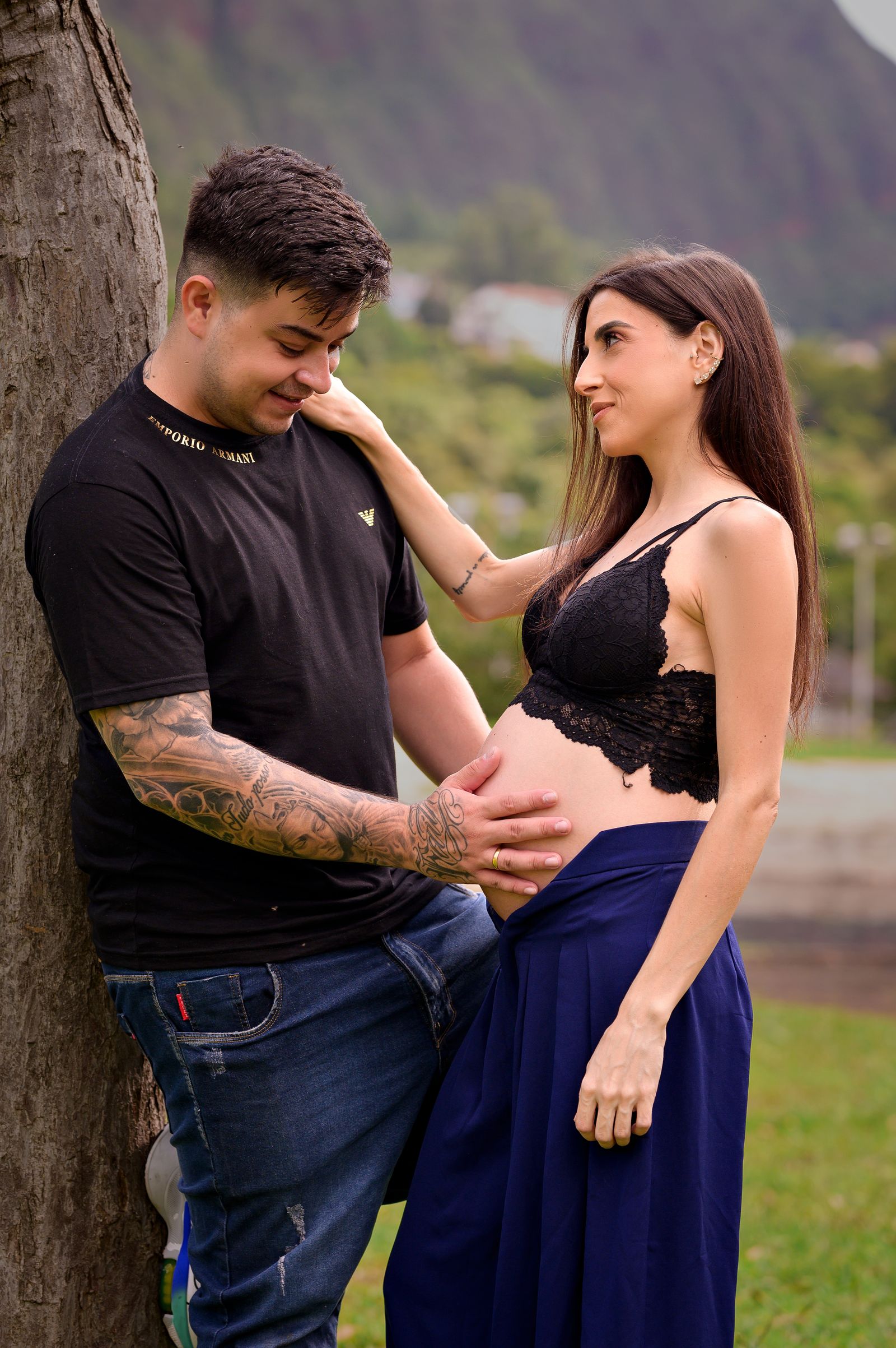 Expectant couple sharing a supportive embrace