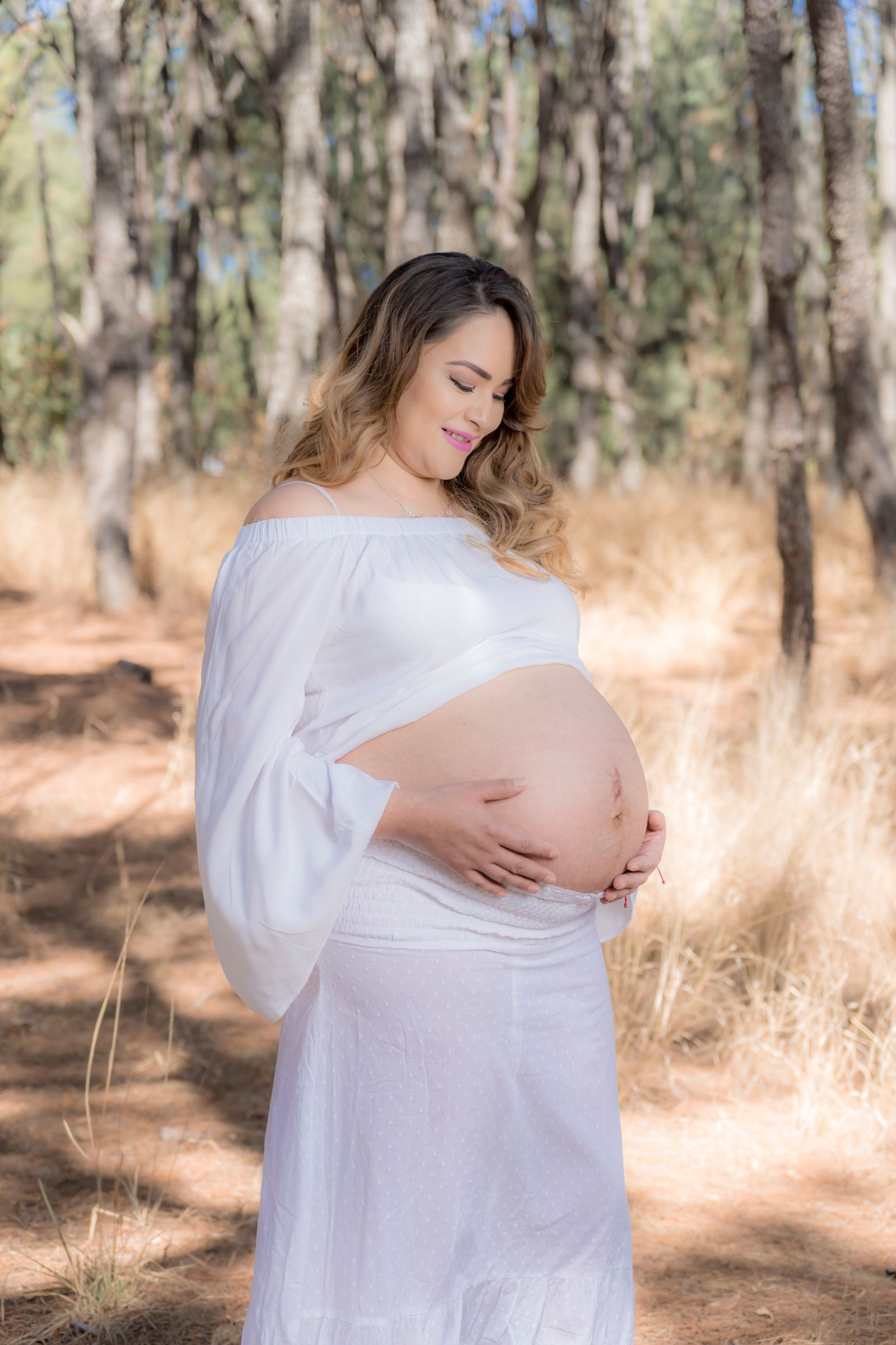 Pregnant person wearing comfortable maternity clothing