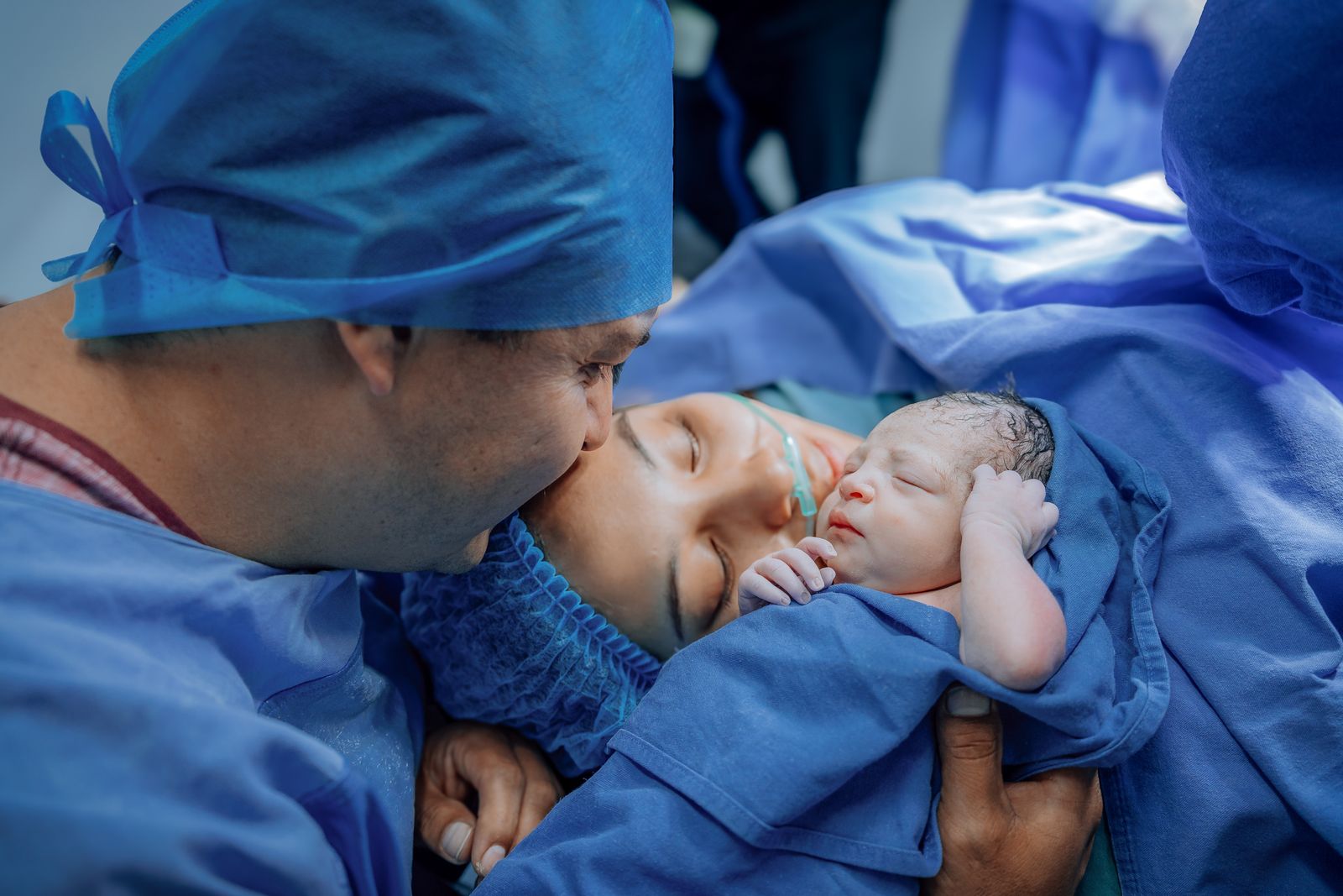 Newborn with parents in a hospital setting