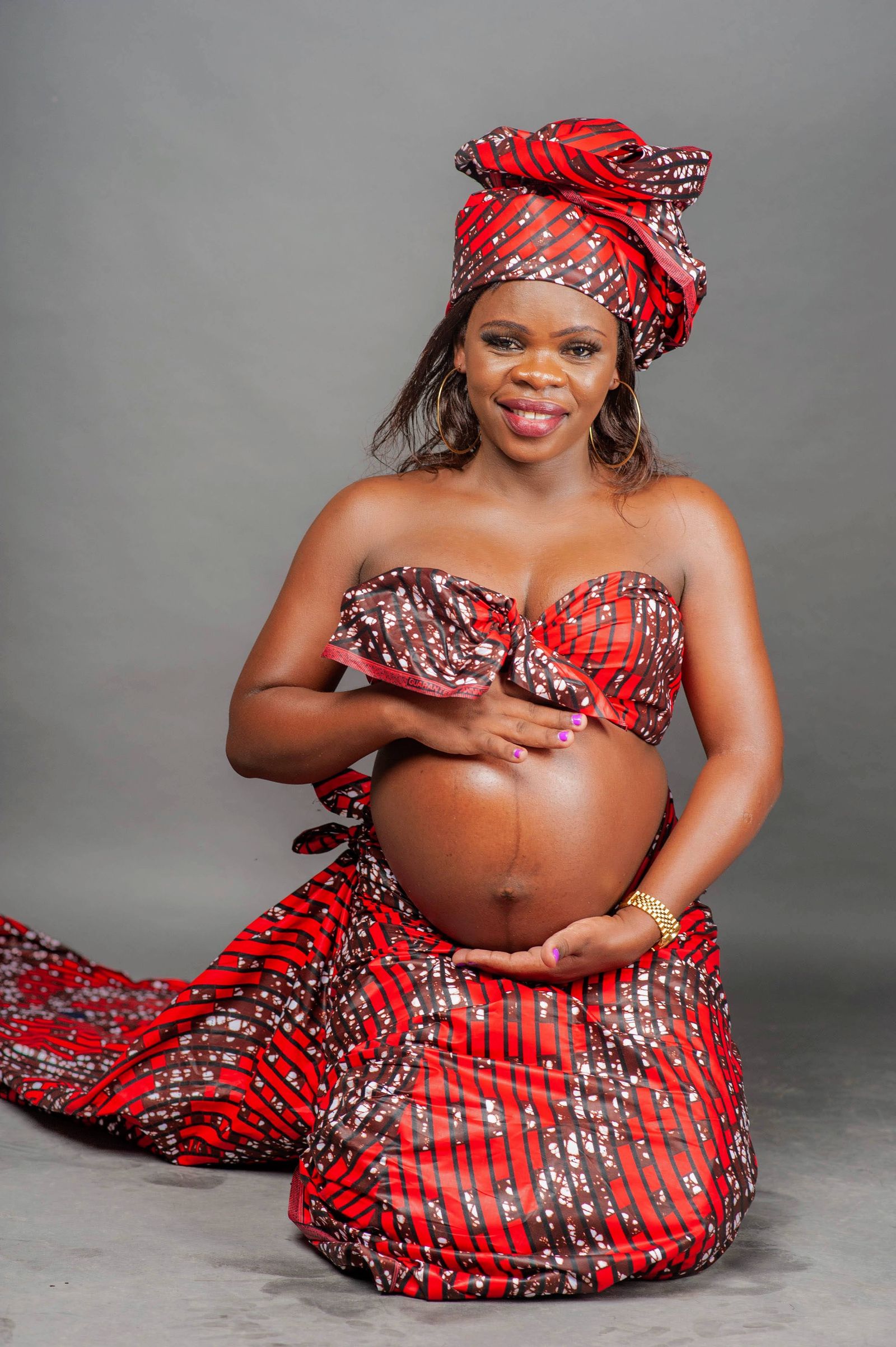 Pregnant person outdoors in seasonal maternity clothing