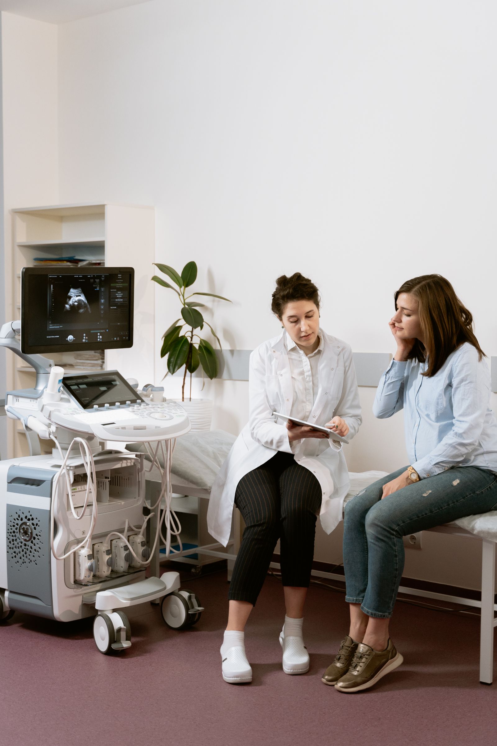 Pregnant person receiving a prenatal checkup